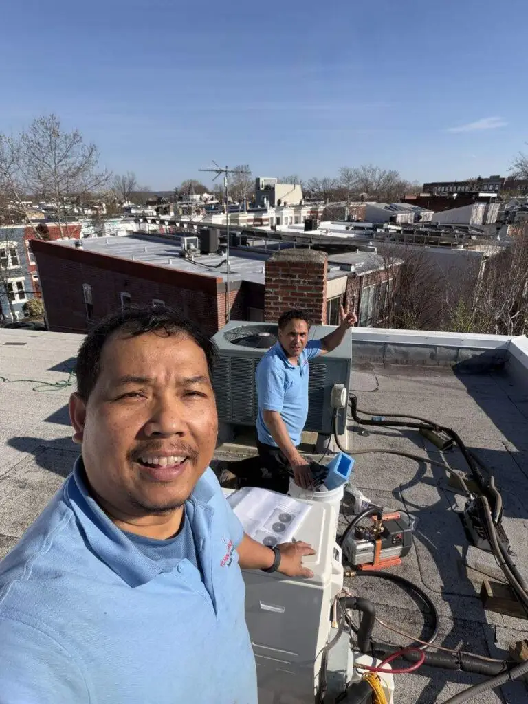 TC HVAC Services technician servicing a commercial rooftop HVAC unit in Northern Virginia
